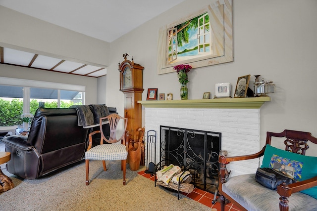 sitting room with a fireplace and tile flooring