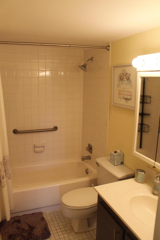 full bathroom with shower / tub combo, vanity, tile flooring, and toilet