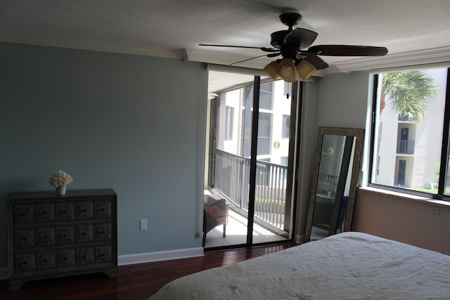 bedroom with ceiling fan, access to outside, multiple windows, and dark hardwood / wood-style flooring