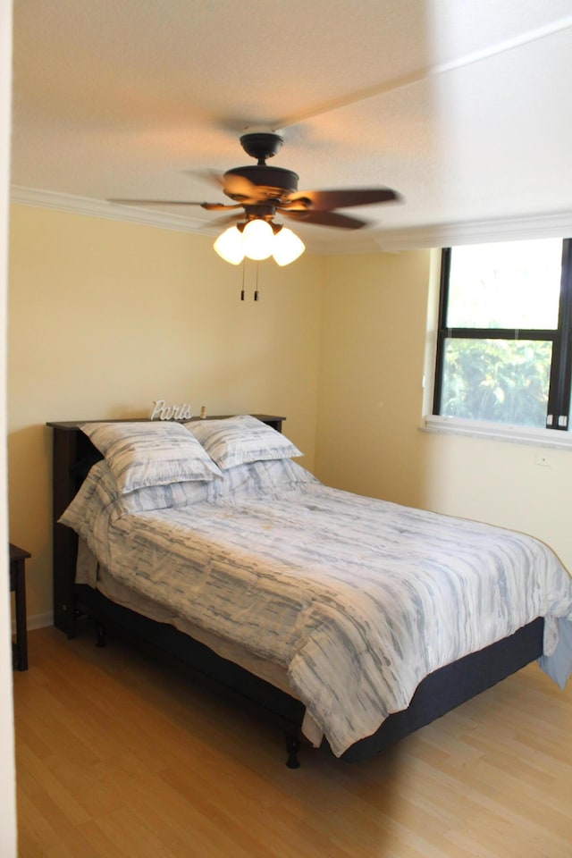 bedroom featuring ceiling fan and light wood-type flooring