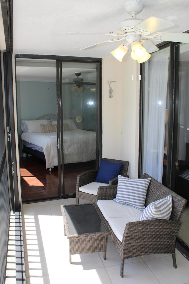 bedroom featuring ceiling fan and light tile flooring