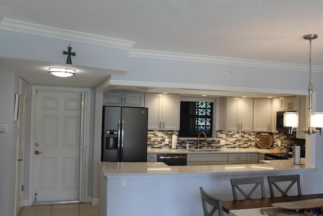 kitchen featuring gray cabinets, hanging light fixtures, ornamental molding, backsplash, and black appliances