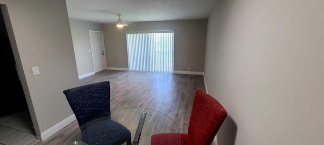 dining space with ceiling fan and dark hardwood / wood-style flooring