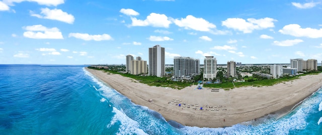 bird's eye view featuring a water view and a beach view