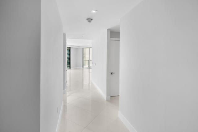 hallway with light tile patterned floors