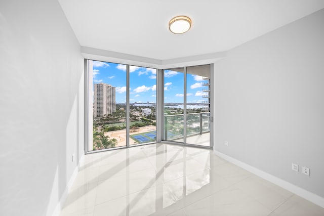 empty room with light tile patterned floors