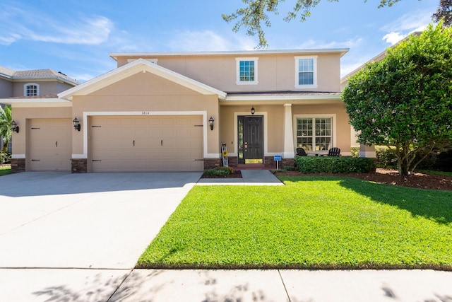 view of front of house featuring a front yard and a garage