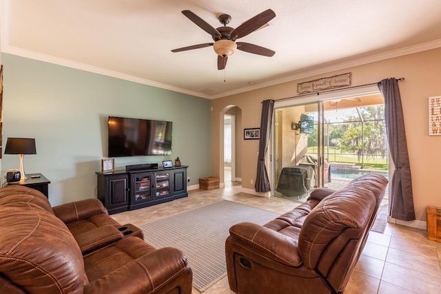 tiled living room with ornamental molding and ceiling fan