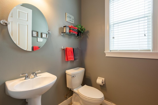 bathroom with toilet and sink