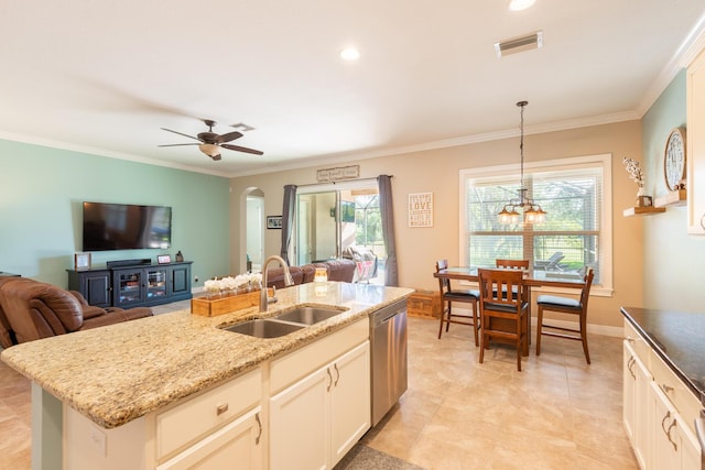 kitchen featuring a kitchen island with sink, sink, light tile floors, hanging light fixtures, and ceiling fan with notable chandelier