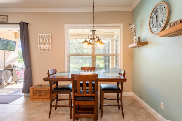 dining area featuring an inviting chandelier, light tile floors, and ornamental molding