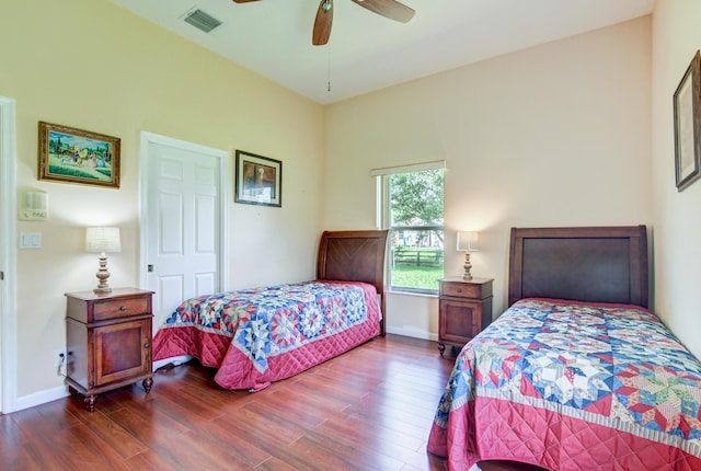 bedroom featuring ceiling fan and dark wood-type flooring