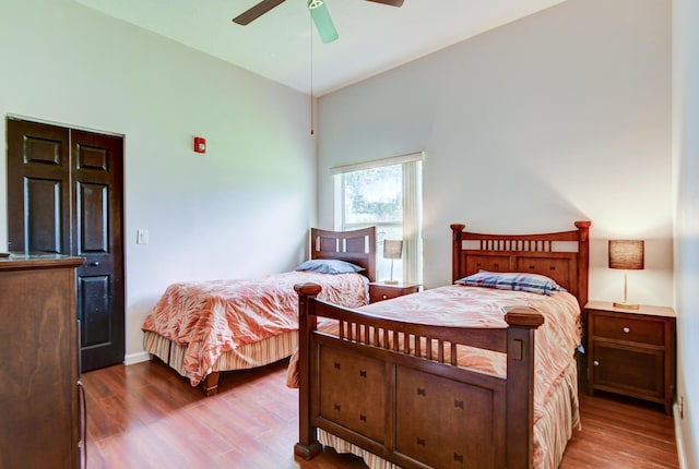 bedroom featuring ceiling fan and dark hardwood / wood-style flooring