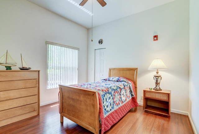 bedroom featuring a closet, ceiling fan, and hardwood / wood-style flooring