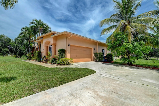 view of front facade with a front lawn and a garage