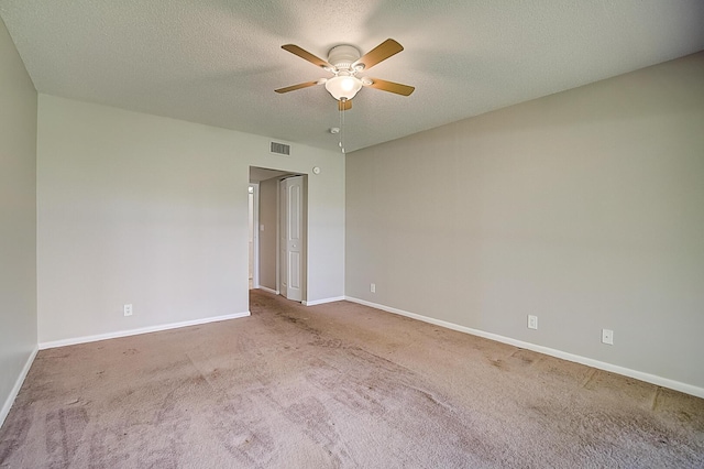 200 Waterway Dr S Unit 102, Lantana, FL 33462 - spare room featuring a textured ceiling, ceiling fan, and dark carpet
