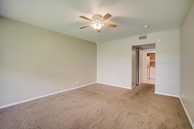 200 Waterway Dr S Unit 102, Lantana, FL 33462 - spare room featuring light carpet, ceiling fan, and a textured ceiling