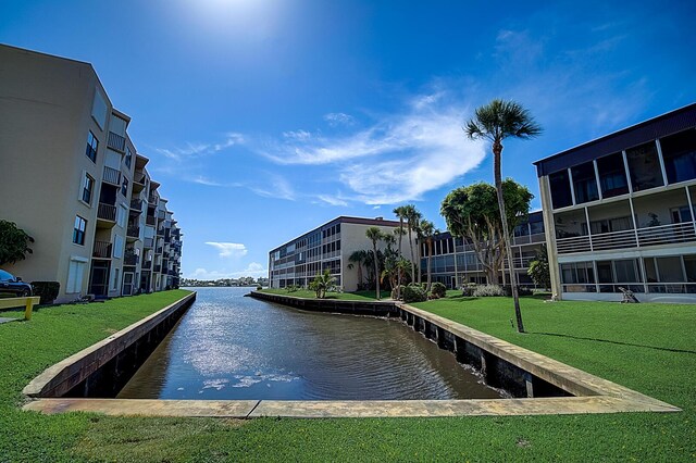 200 Waterway Dr S Unit 102, Lantana, FL 33462 - exterior space with a lawn and a water view