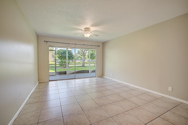 200 Waterway Dr S Unit 102, Lantana, FL 33462 - tiled spare room featuring a textured ceiling and ceiling fan