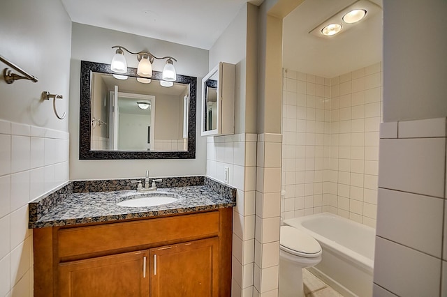 200 Waterway Dr S Unit 102, Lantana, FL 33462 - full bathroom with vanity, tiled shower / bath, toilet, and tile walls