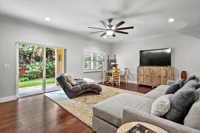 living room with ornamental molding, dark hardwood / wood-style flooring, a textured ceiling, and ceiling fan