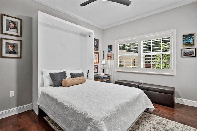 bedroom featuring ceiling fan, dark hardwood / wood-style floors, and crown molding