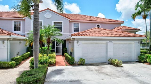 mediterranean / spanish-style house featuring a garage