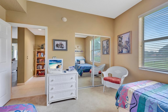 carpeted bedroom featuring a closet