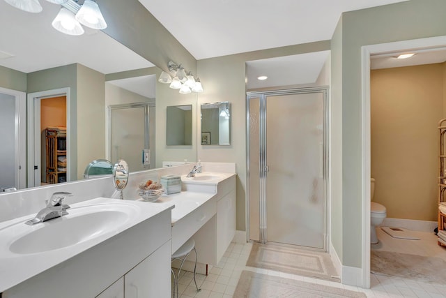 bathroom with double sink, tile flooring, a shower with shower door, and oversized vanity