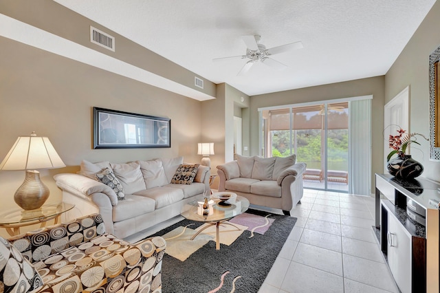 tiled living room featuring ceiling fan