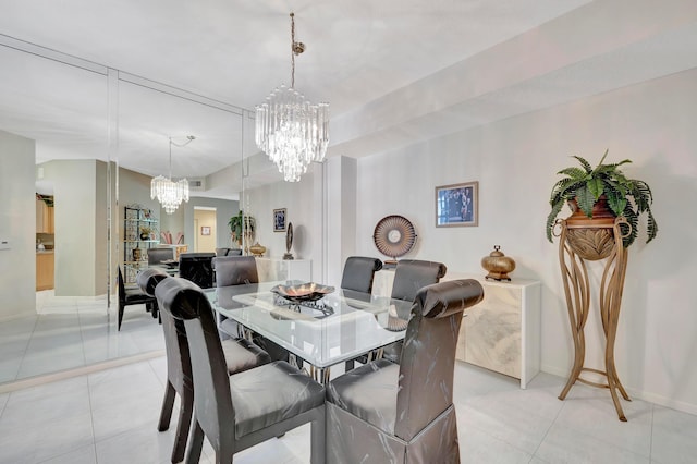 dining room featuring an inviting chandelier and light tile floors