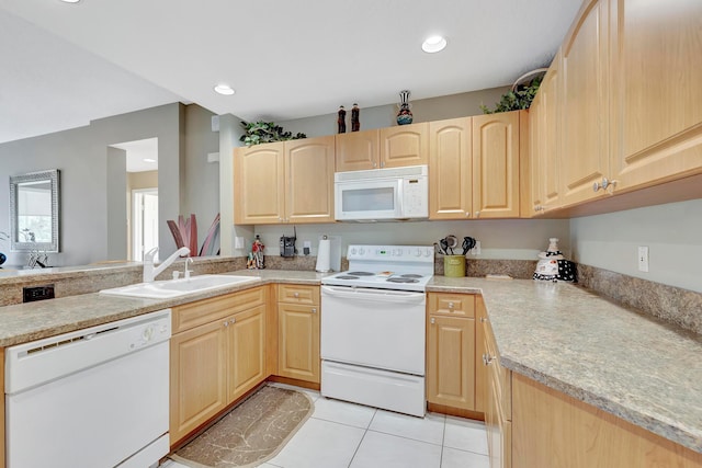 kitchen with light tile floors, kitchen peninsula, light brown cabinetry, white appliances, and sink