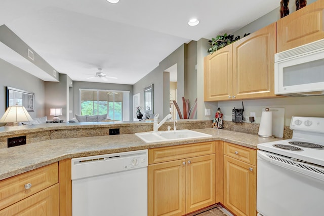 kitchen featuring ceiling fan, kitchen peninsula, light brown cabinetry, white appliances, and sink