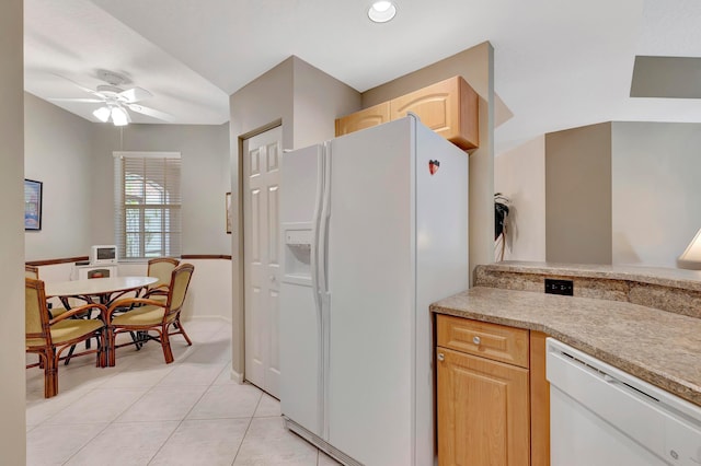 kitchen featuring light tile floors, ceiling fan, light brown cabinetry, and white appliances