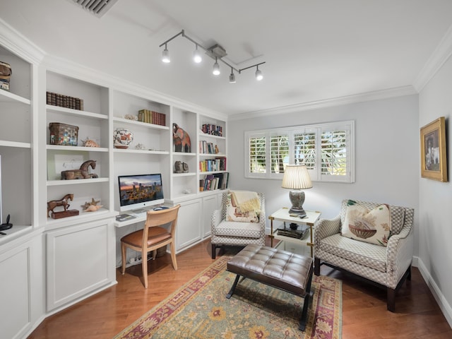 sitting room with crown molding, built in features, light hardwood / wood-style flooring, and track lighting