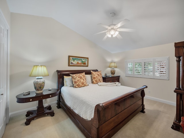 carpeted bedroom featuring vaulted ceiling and ceiling fan