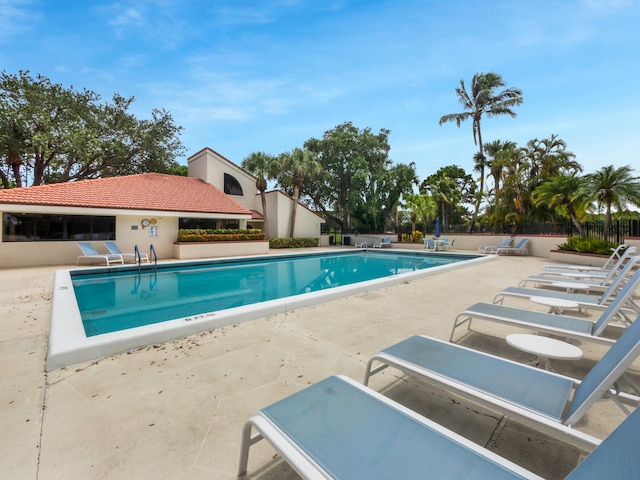 view of swimming pool featuring a patio