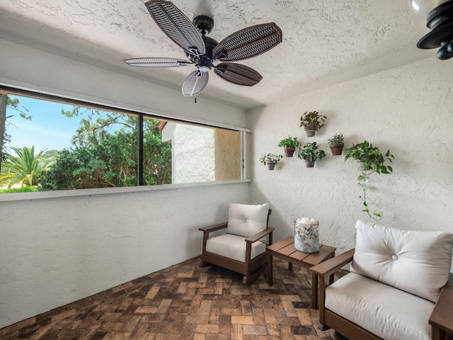 sunroom / solarium with ceiling fan