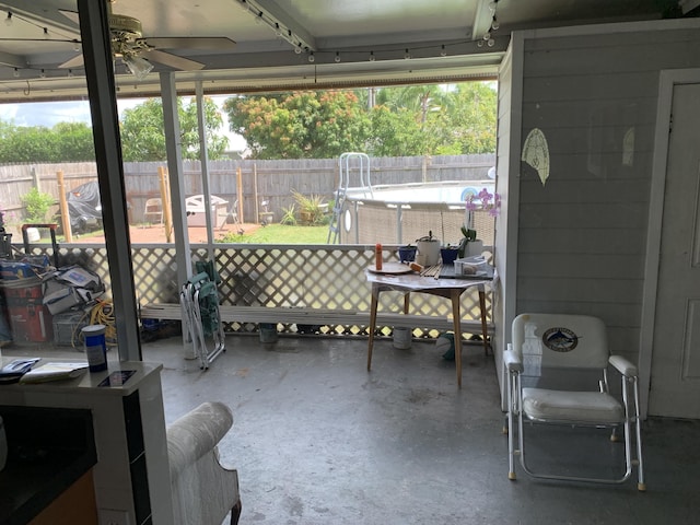 view of patio / terrace with a fenced in pool