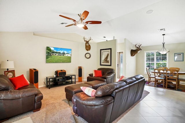 tiled living room with vaulted ceiling and ceiling fan