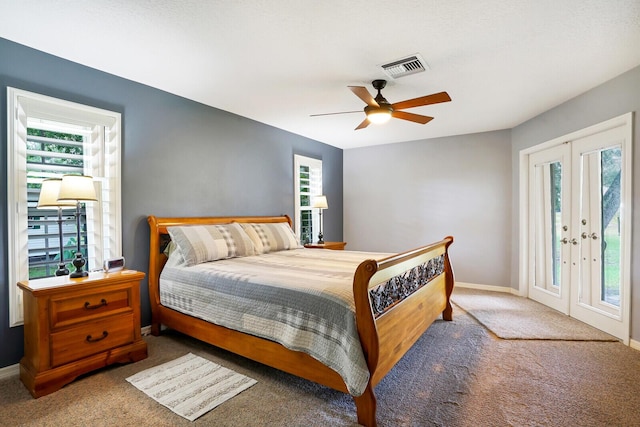 carpeted bedroom with access to outside, ceiling fan, and french doors