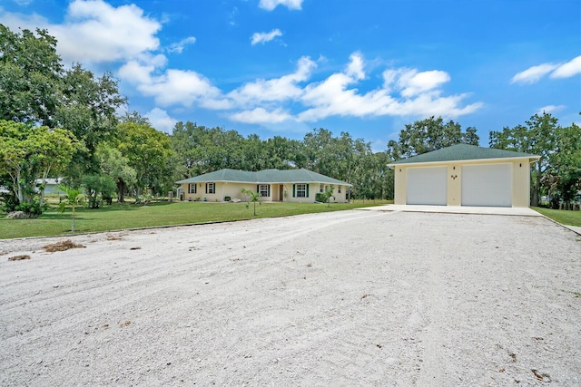 ranch-style house with a front yard and a garage