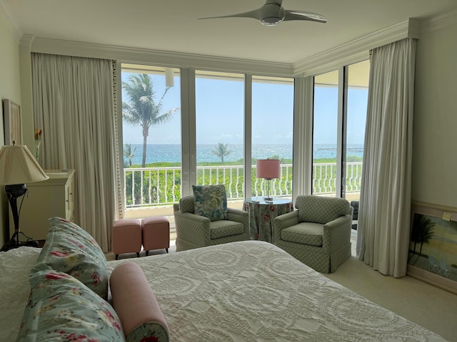 bedroom featuring a water view, light colored carpet, ceiling fan, and crown molding