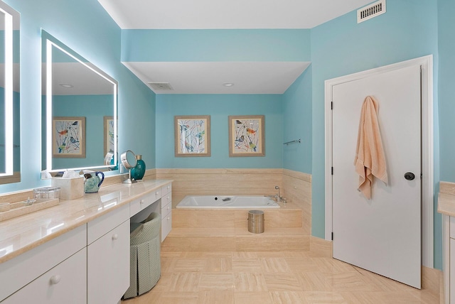 bathroom with vanity and a bathing tub