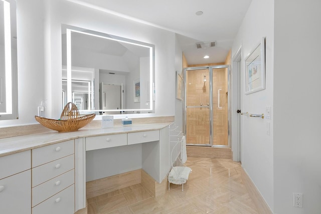 bathroom with an enclosed shower and vanity