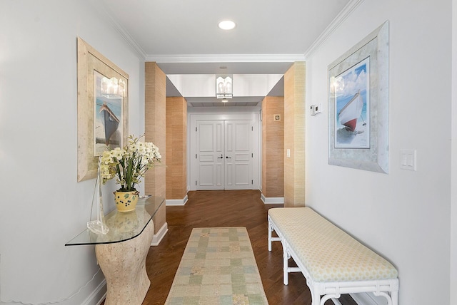 corridor with ornamental molding and dark hardwood / wood-style flooring