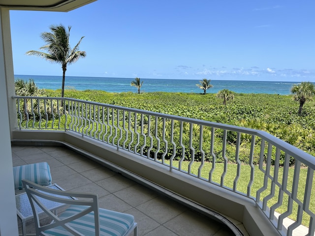 balcony featuring a water view