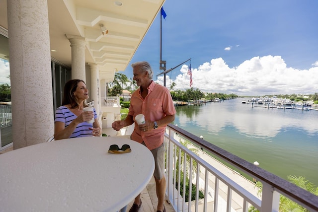 balcony featuring a water view