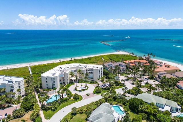 bird's eye view featuring a view of the beach and a water view