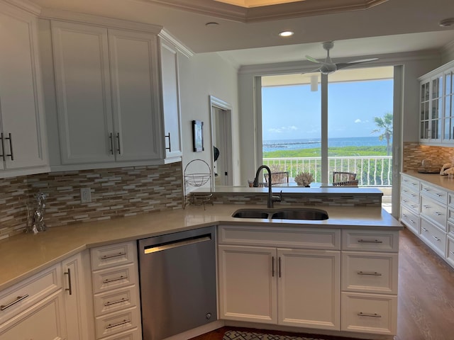 kitchen featuring sink, ceiling fan, hardwood / wood-style floors, white cabinets, and dishwasher